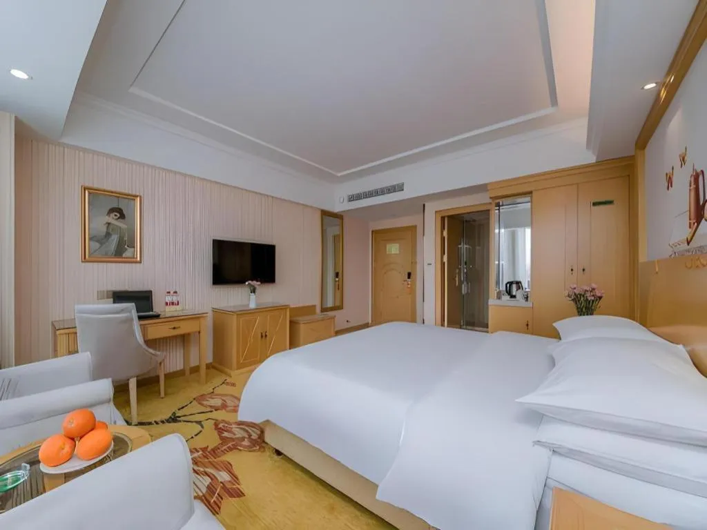 Bed in Vienna Hotel Wuhan Huazhong Normal University Huquan Metro Station