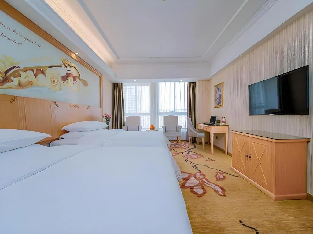 Bed in Vienna Hotel Wuhan Huazhong Normal University Huquan Metro Station