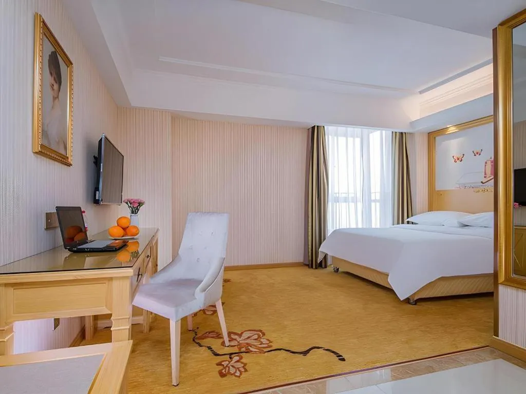 Bed in Vienna Hotel Wuhan Huazhong Normal University Huquan Metro Station