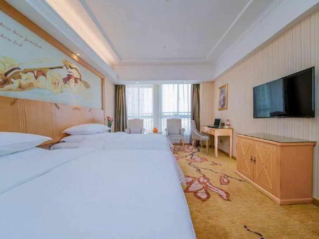 Bed in Vienna Hotel Wuhan Huazhong Normal University Huquan Metro Station