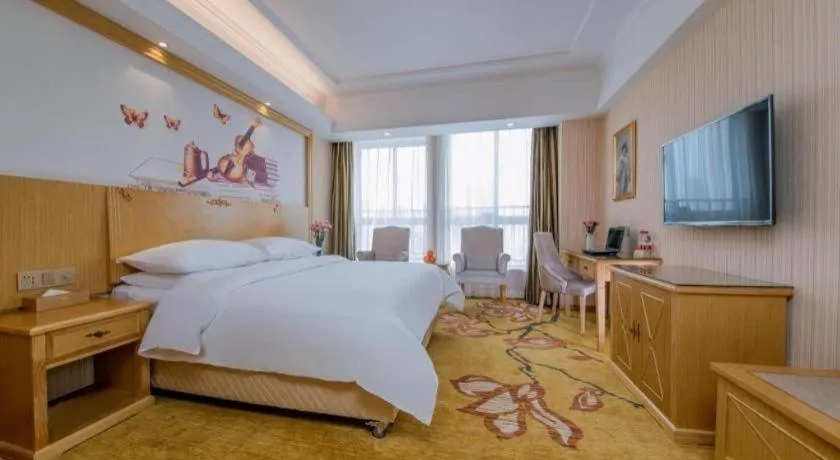 Bed in Vienna Hotel Wuhan Huazhong Normal University Huquan Metro Station