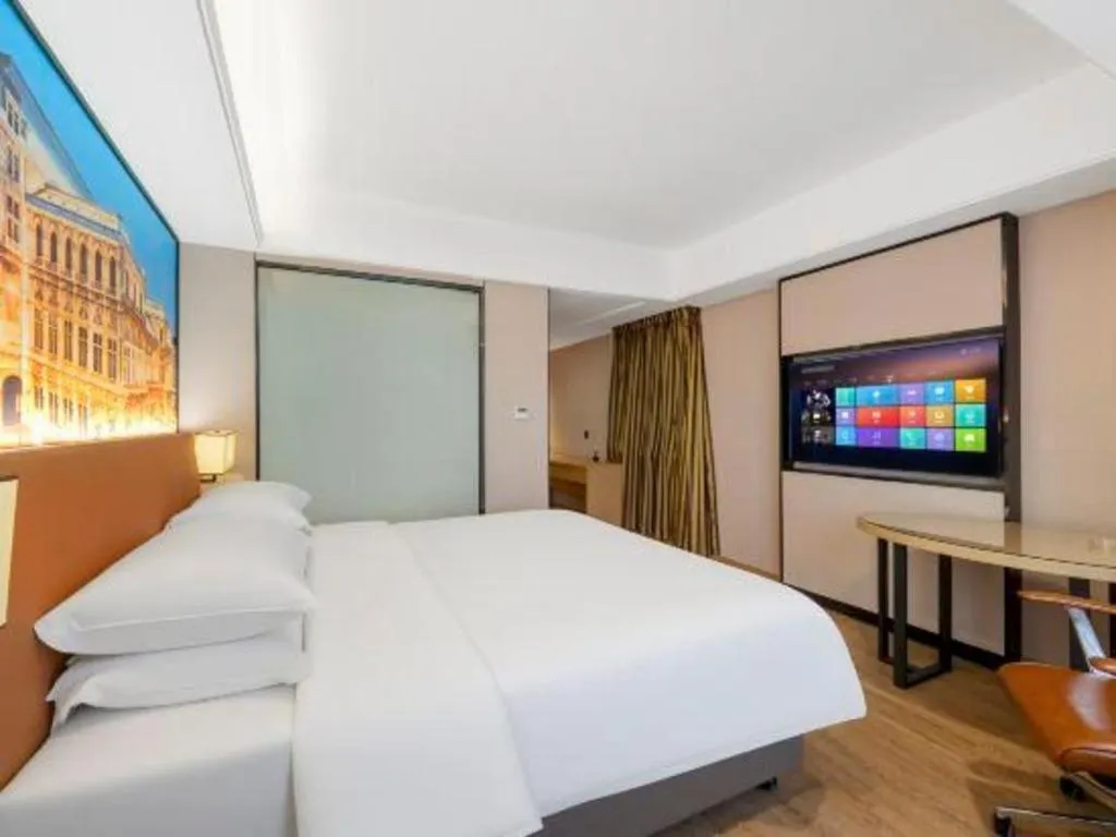 Bed in Vienna Hotel Shandong Jinan High-Tech Wanda Exhibition Center