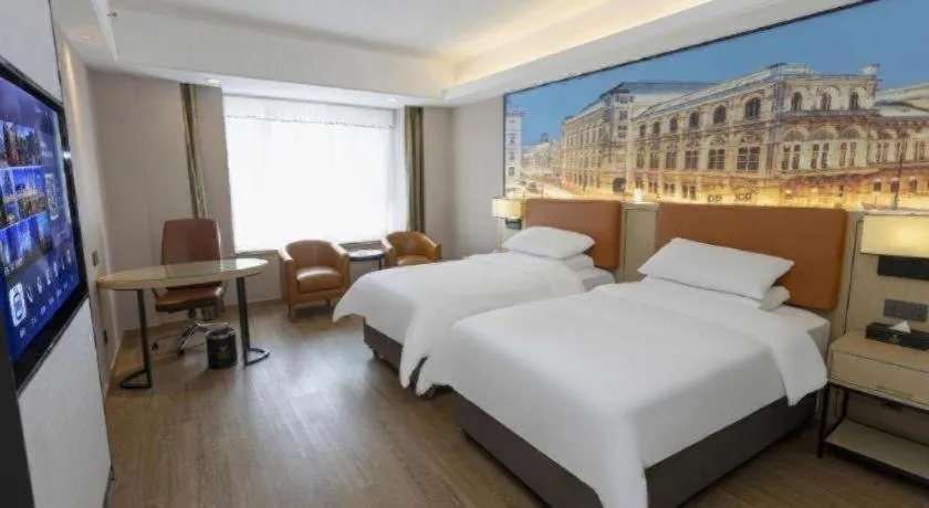 Bed in Vienna Hotel Shandong Jinan High-Tech Wanda Exhibition Center