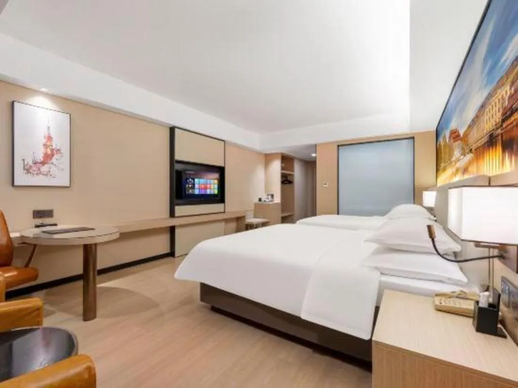 Bed in Vienna Hotel Shandong Jinan High-Tech Wanda Exhibition Center