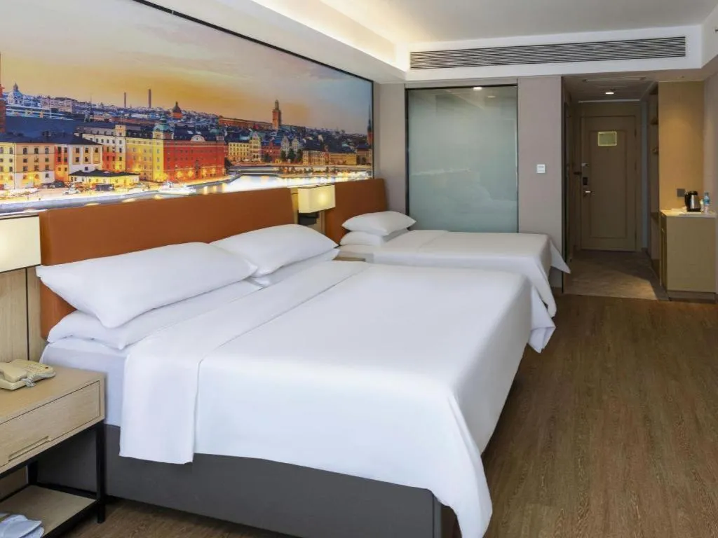 Bed in Vienna Hotel Shandong Jinan High-Tech Wanda Exhibition Center