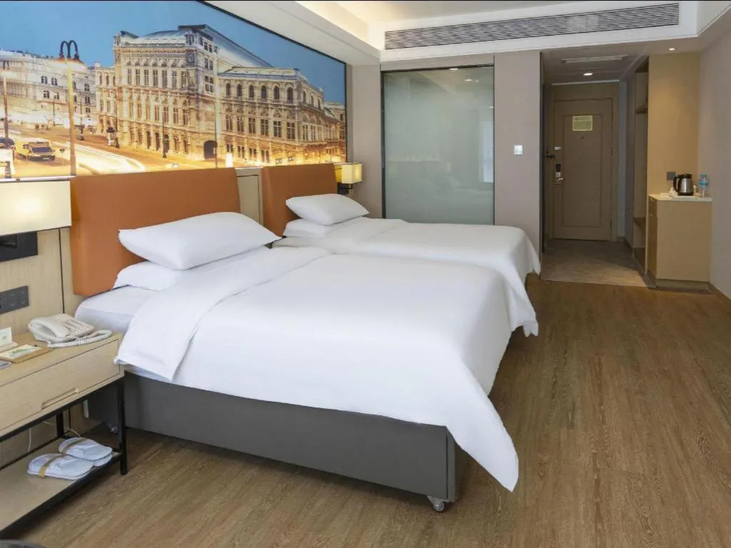 Bed in Vienna Hotel Shandong Jinan High-Tech Wanda Exhibition Center