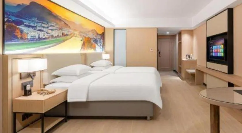 Bed in Vienna Hotel Shandong Jinan High-Tech Wanda Exhibition Center