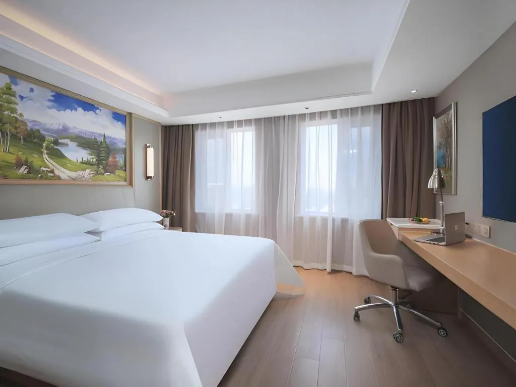 Bed in Vienna Hotel Tianjin Olympic Sports Center Tianta