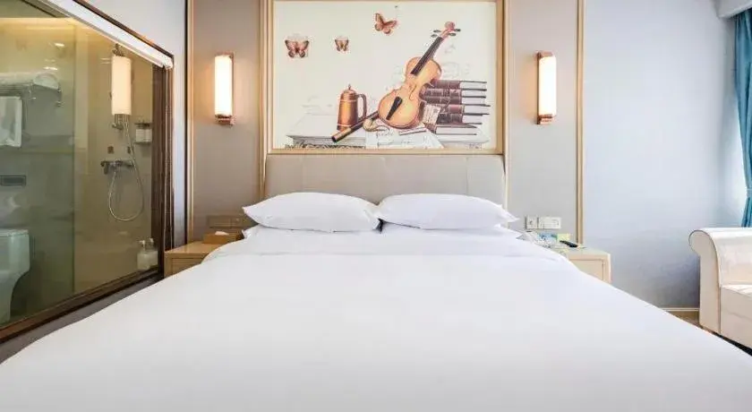 Bed in Vienna Hotel Kunming Baiyun Road Metro Station Jiang'an Bed in Vienna Hotel Kunming Baiyun Road Metro Station Jiang'an