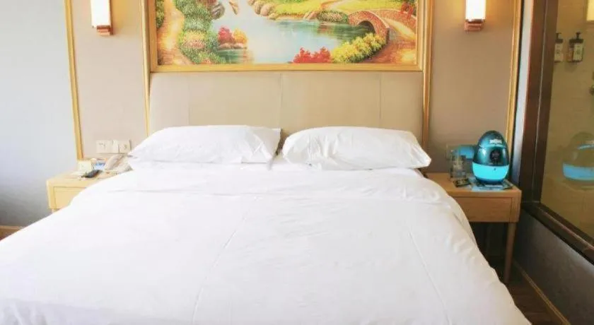 Bed in Vienna Hotel Kunming Baiyun Road Metro Station Jiang'an