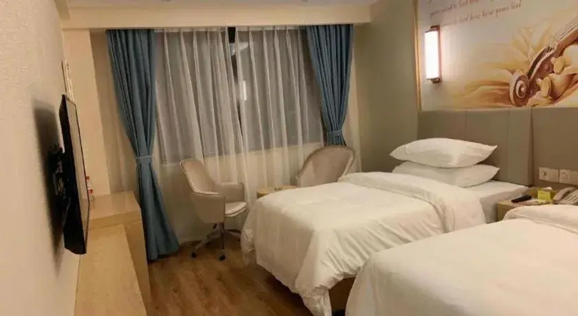 Bed in Vienna Hotel Kunming Baiyun Road Metro Station Jiang'an Bed in Vienna Hotel Kunming Baiyun Road Metro Station Jiang'an