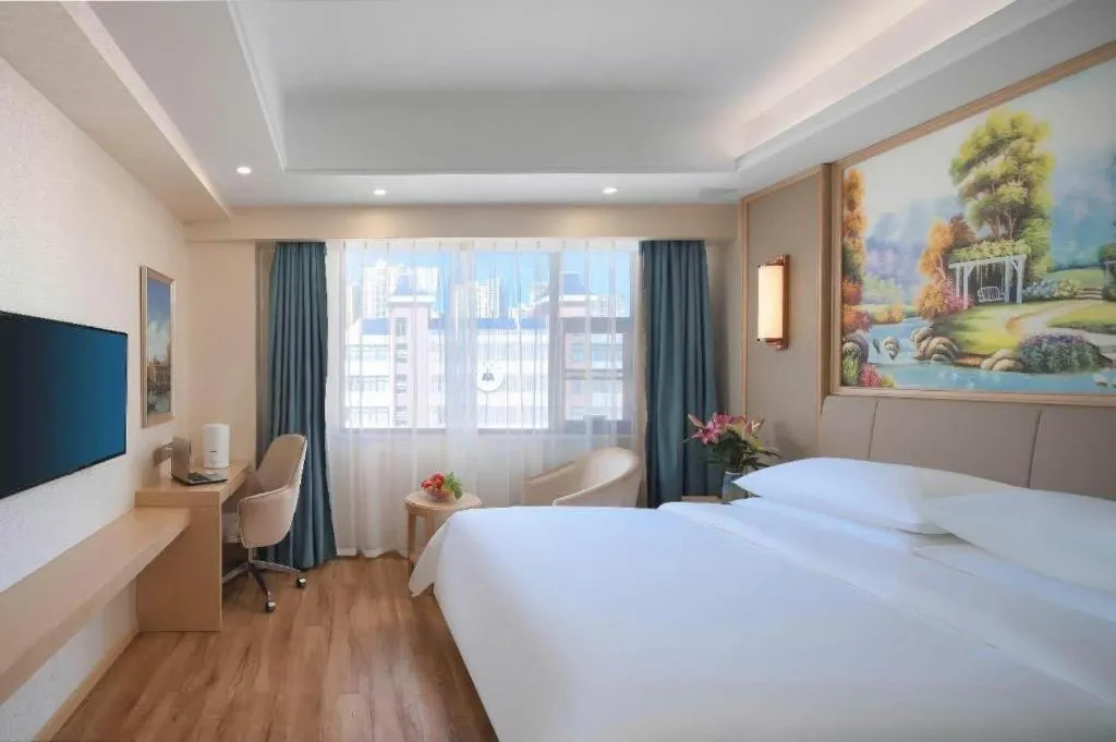 Bed in Vienna Hotel Kunming Baiyun Road Metro Station Jiang'an