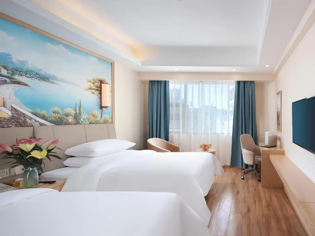 Bed in Vienna Hotel Kunming Baiyun Road Metro Station Jiang'an