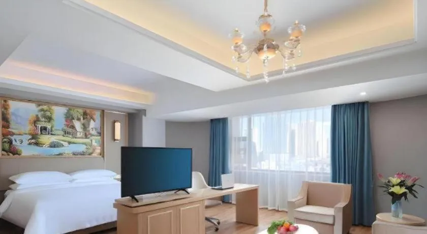 Bed in Vienna Hotel Kunming Baiyun Road Metro Station Jiang'an