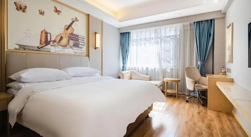 Bed in Vienna Hotel Kunming Baiyun Road Metro Station Jiang'an