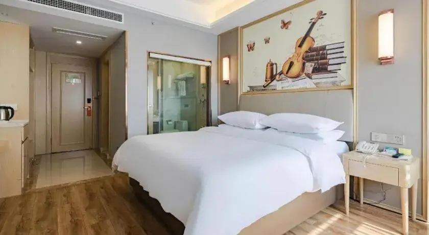 Bed in Vienna Hotel Kunming Baiyun Road Metro Station Jiang'an Bed in Vienna Hotel Kunming Baiyun Road Metro Station Jiang'an