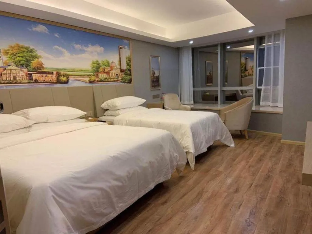 Bed in Vienna Hotel Kunming Baiyun Road Metro Station Jiang'an