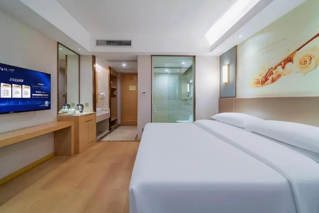 Bed in Vienna Hotel Chongqing Shiqiaopu Metro Station Bed in Vienna Hotel Chongqing Shiqiaopu Metro Station