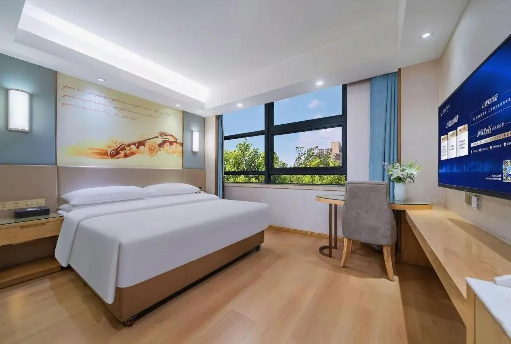 Bed in Vienna Hotel Chongqing Shiqiaopu Metro Station