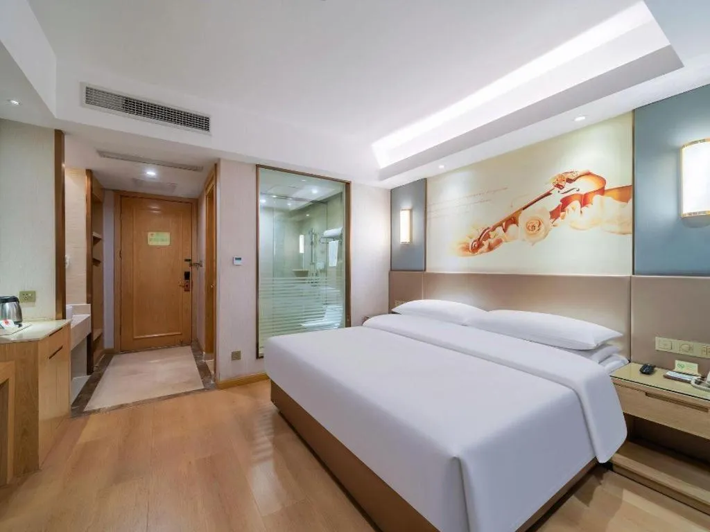 Bed in Vienna Hotel Chongqing Shiqiaopu Metro Station