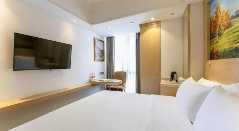 Bed in Vienna Hotel Chongqing Yangjiaping Pedestrian Street Light Railway Station