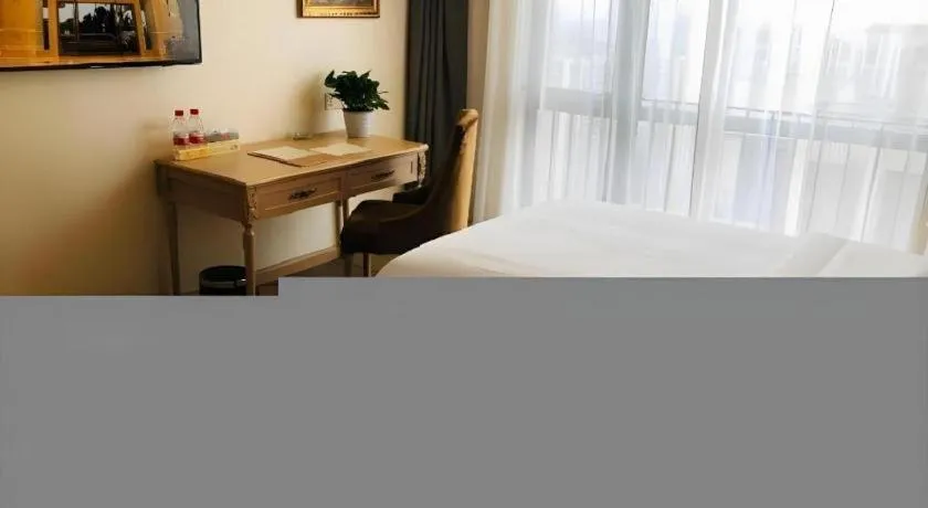 Bed in Vienna Hotel Chongqing Yangjiaping Pedestrian Street Light Railway Station