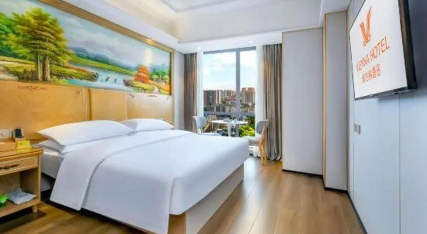 Bed in Vienna Hotel Chongqing Yangjiaping Pedestrian Street Light Railway Station