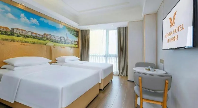 Bed in Vienna Hotel Chongqing Yangjiaping Pedestrian Street Light Railway Station