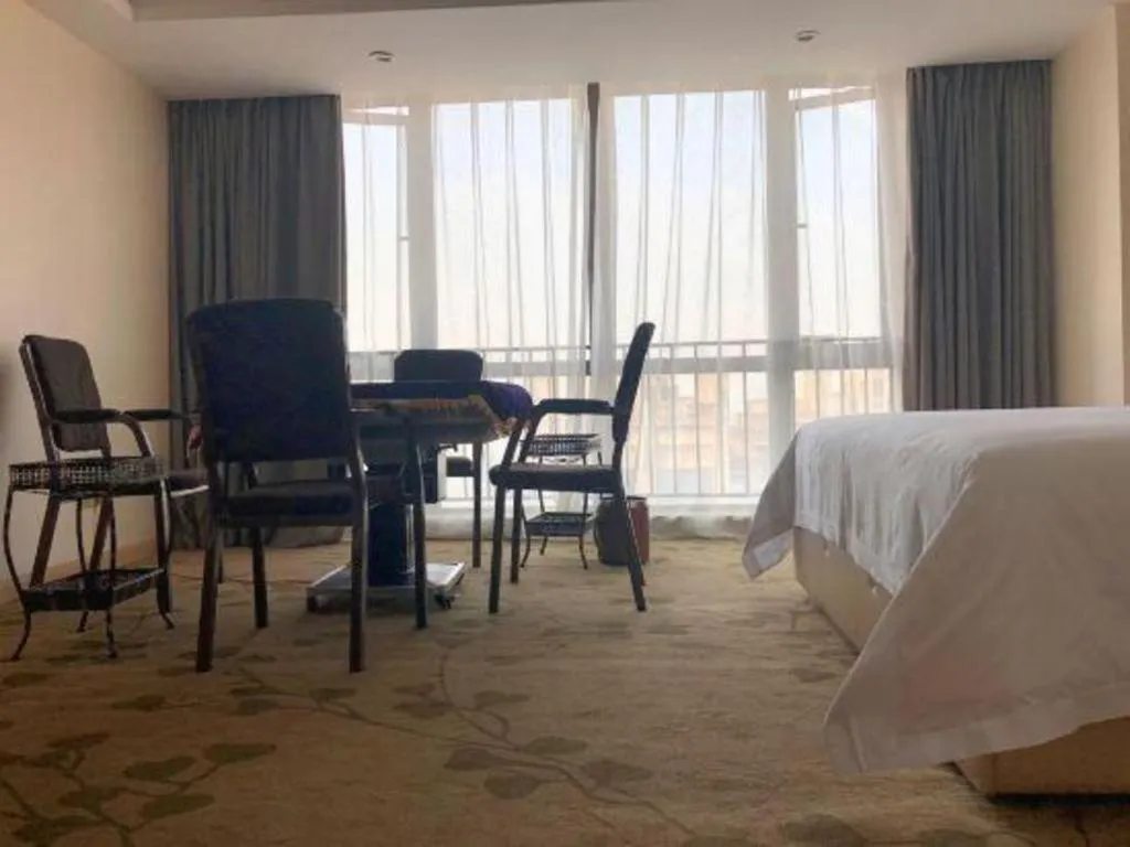 Bed in Vienna Hotel Chongqing Yangjiaping Pedestrian Street Light Railway Station