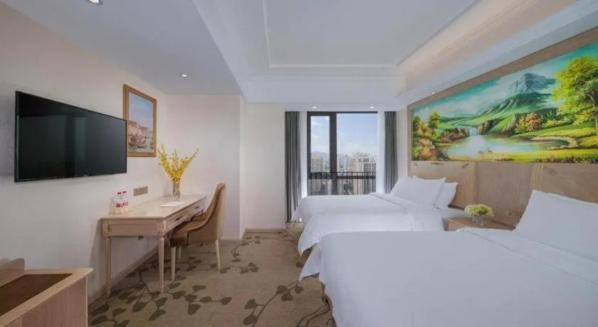 Bed in Vienna Hotel Chongqing Yangjiaping Pedestrian Street Light Railway Station