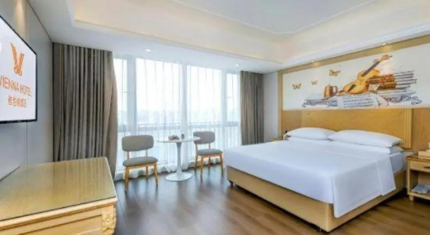 Bed in Vienna Hotel Chongqing Yangjiaping Pedestrian Street Light Railway Station