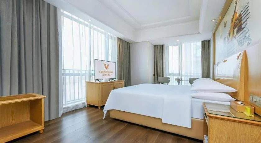 Bed in Vienna Hotel Chongqing Yangjiaping Pedestrian Street Light Railway Station