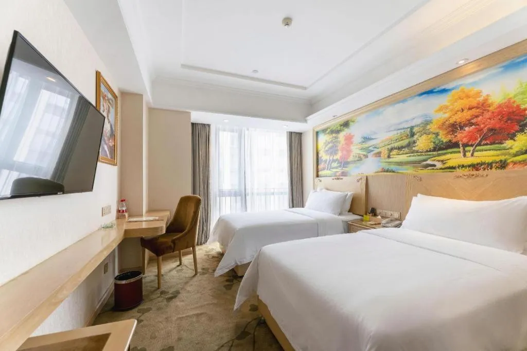 Bed in Vienna Hotel Chongqing Yangjiaping Pedestrian Street Light Railway Station