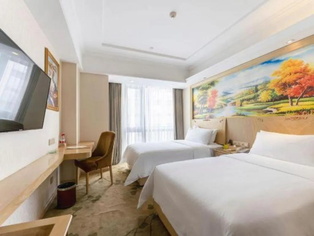 Bed in Vienna Hotel Chongqing Yangjiaping Pedestrian Street Light Railway Station