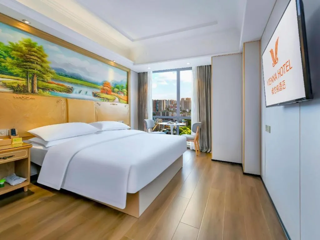 Bed in Vienna Hotel Chongqing Yangjiaping Pedestrian Street Light Railway Station