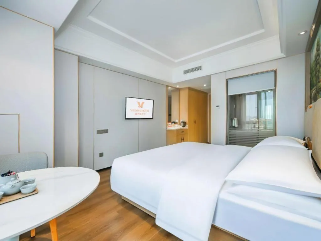 Bed in Vienna Hotel Chongqing Yangjiaping Pedestrian Street Light Railway Station