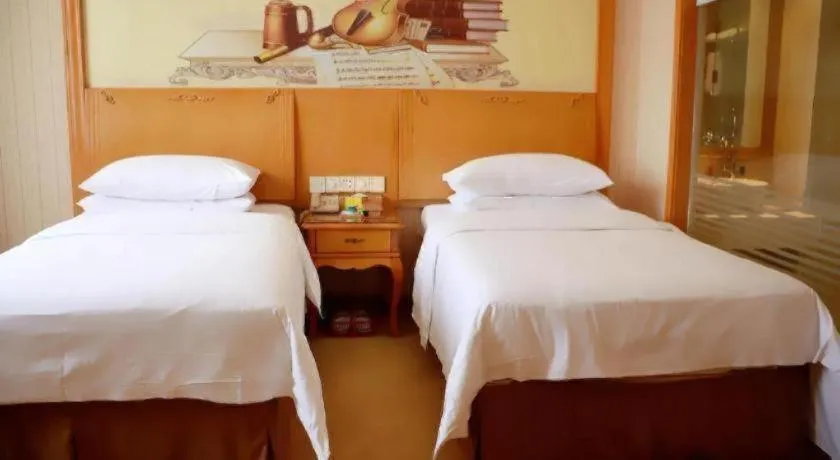 Bed in Vienna Hotel Xi'an Xijing Hospital Tonghuamen Metro Station