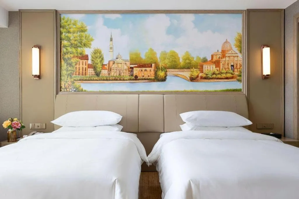 Bed in Vienna Hotel Jiangxi Fuzhou Yihuang