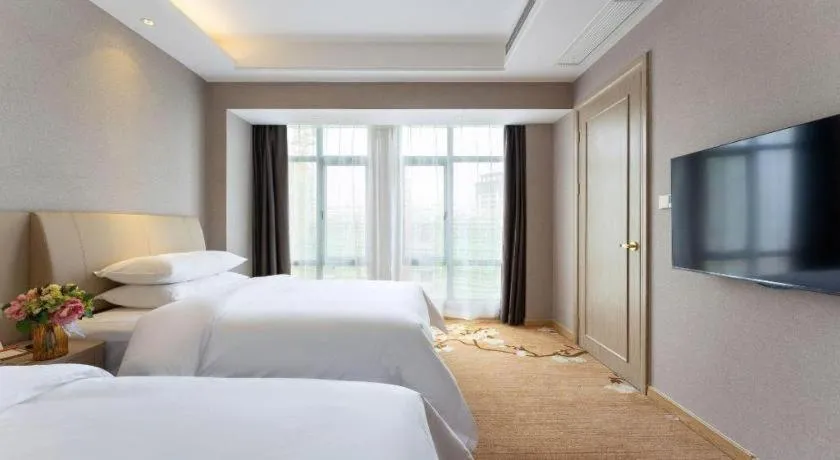Bed in Vienna Hotel Jiangxi Fuzhou Yihuang