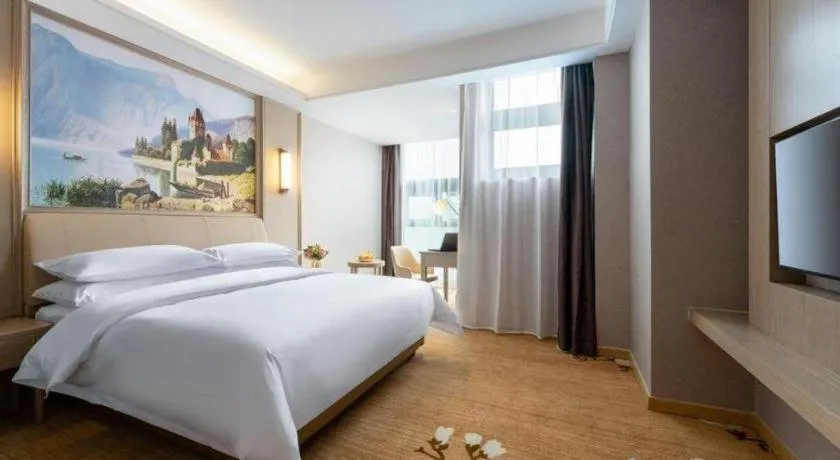 Bed in Vienna Hotel Jiangxi Fuzhou Yihuang