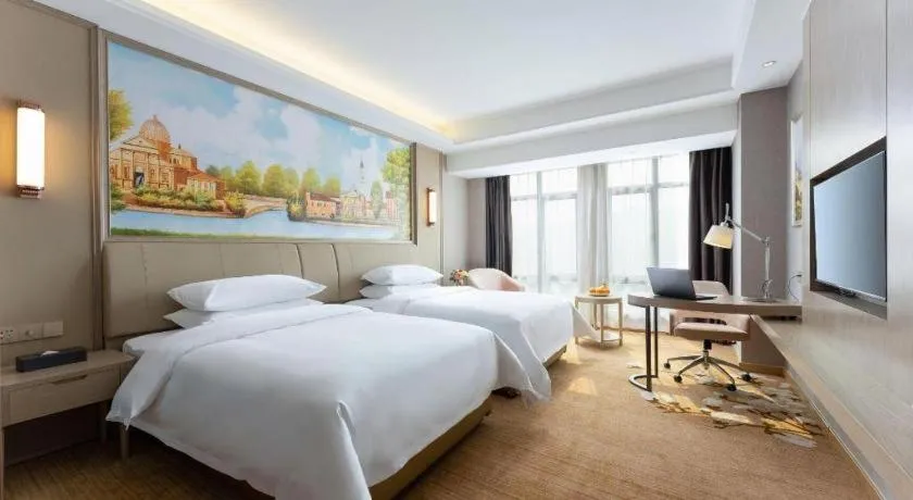 Bed in Vienna Hotel Jiangxi Fuzhou Yihuang