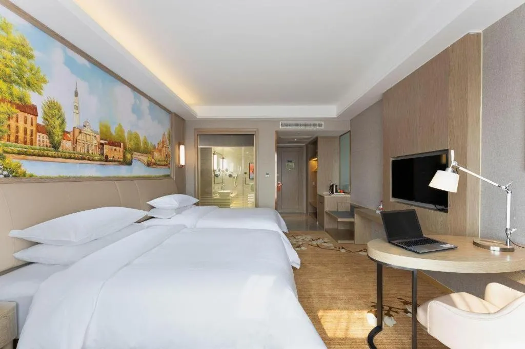 Bed in Vienna Hotel Jiangxi Fuzhou Yihuang