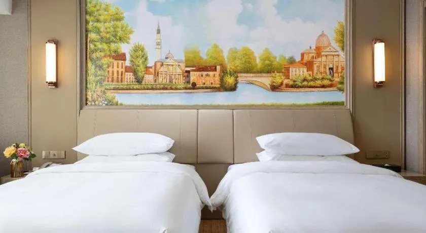 Bed in Vienna Hotel Jiangxi Fuzhou Yihuang