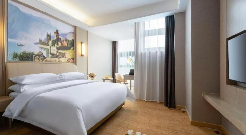 Bed in Vienna Hotel Jiangxi Fuzhou Yihuang