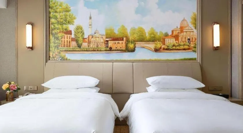 Bed in Vienna Hotel Jiangxi Fuzhou Yihuang