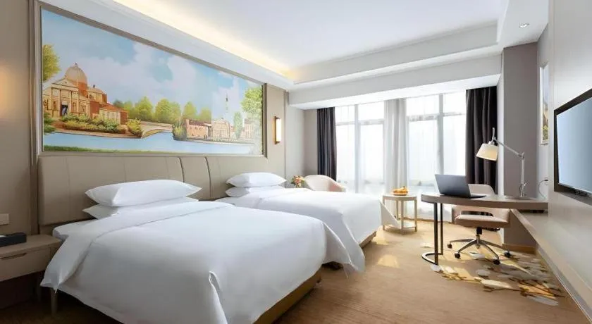 Bed in Vienna Hotel Jiangxi Fuzhou Yihuang