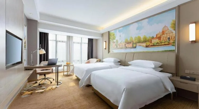 Bed in Vienna Hotel Jiangxi Fuzhou Yihuang