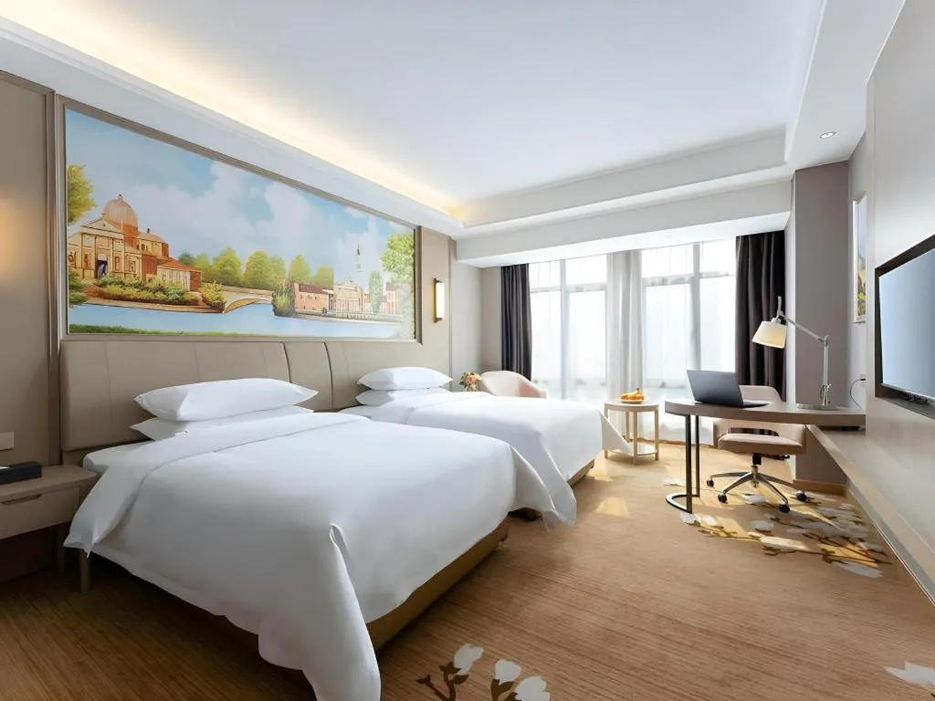 Bed in Vienna Hotel Jiangxi Fuzhou Yihuang