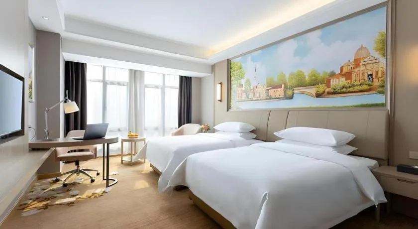 Bed in Vienna Hotel Jiangxi Fuzhou Yihuang