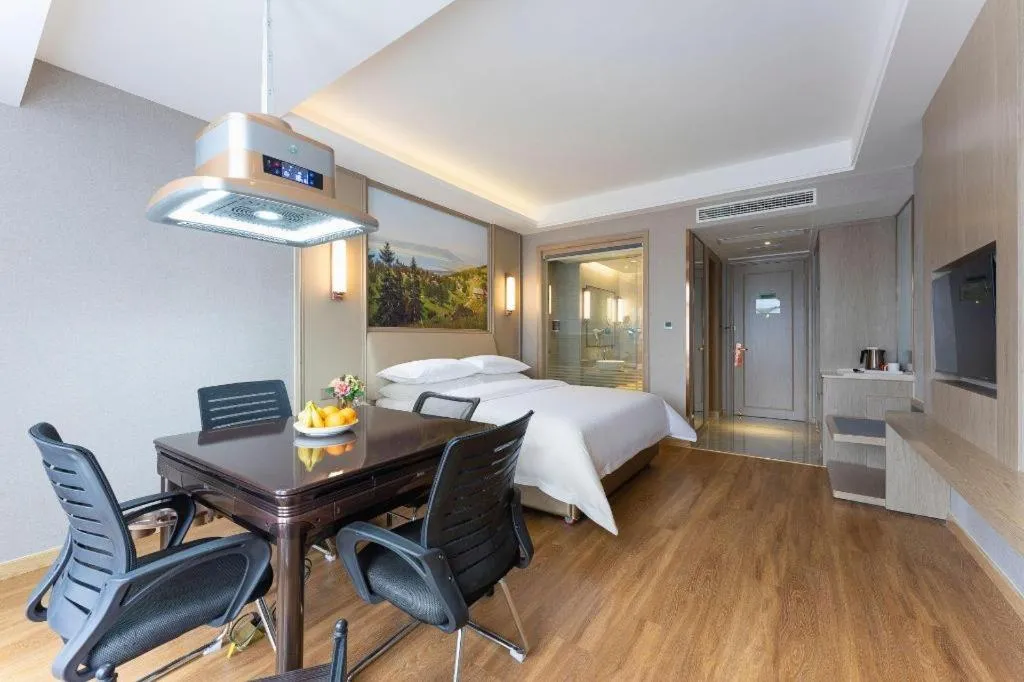 Bed in Vienna Hotel Jiangxi Fuzhou Yihuang